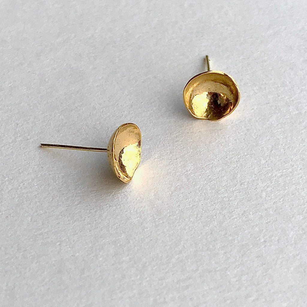 close up of 24k gold handmade domed stud earrings