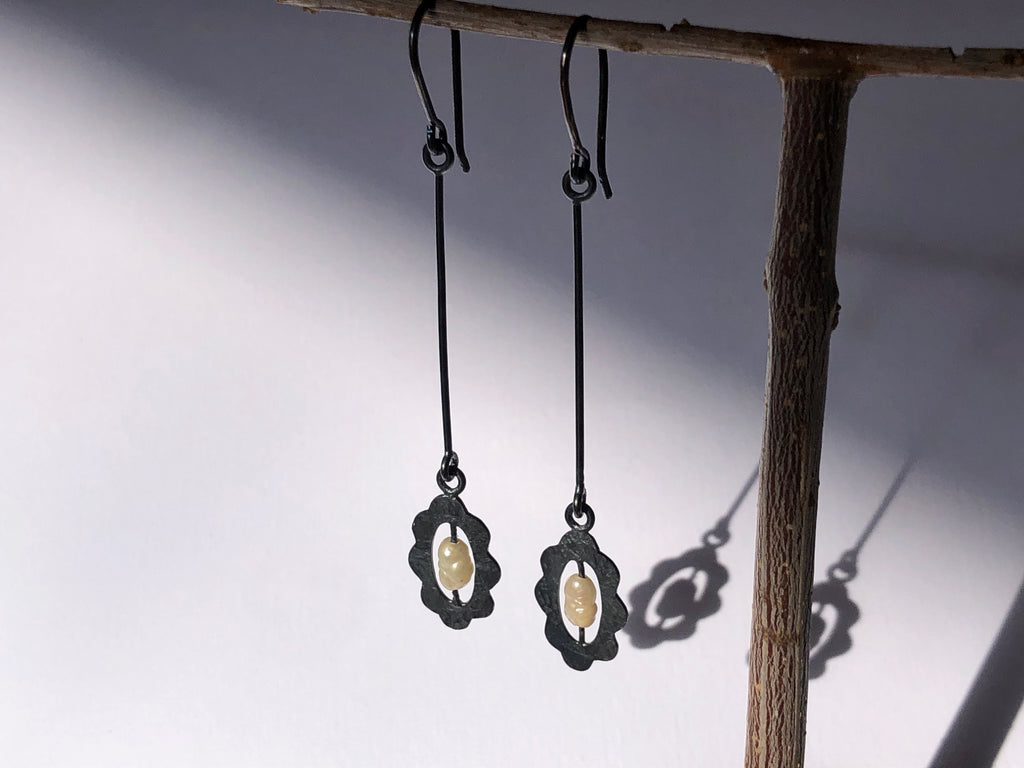 Hnadmade long Oxidised silver dangle earrings.  Small vintage pearl in scalloped -edged frame suspended on long bar and hook.