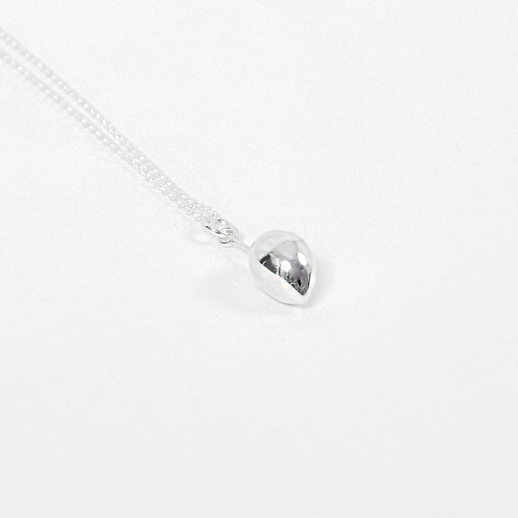 Close up photo of sterling silver olive pendant