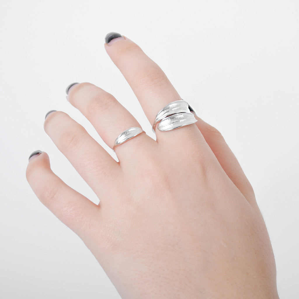 Hand wearing Sterling silver dainty olive leaf ring handmade in Auckland