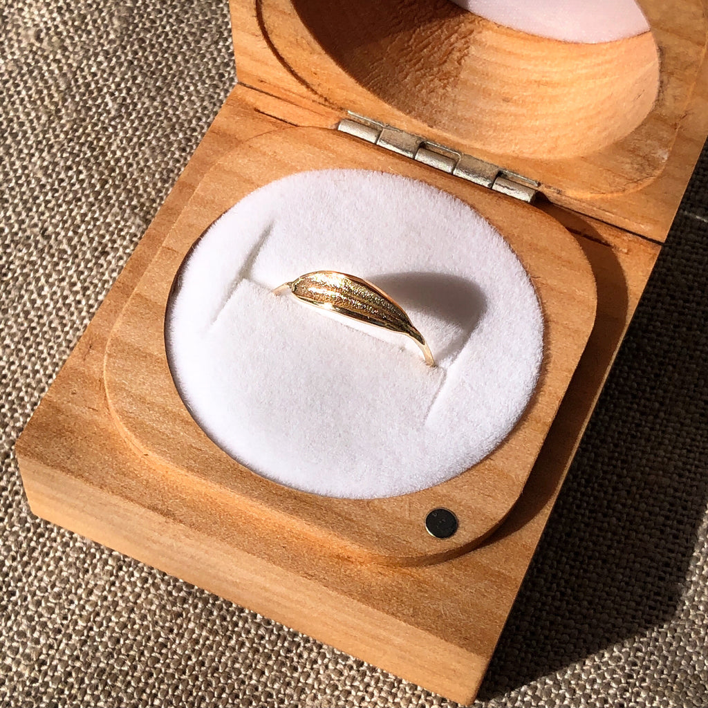 Handmade solid 9k gold dainty olive leaf ring in wooden ring box.