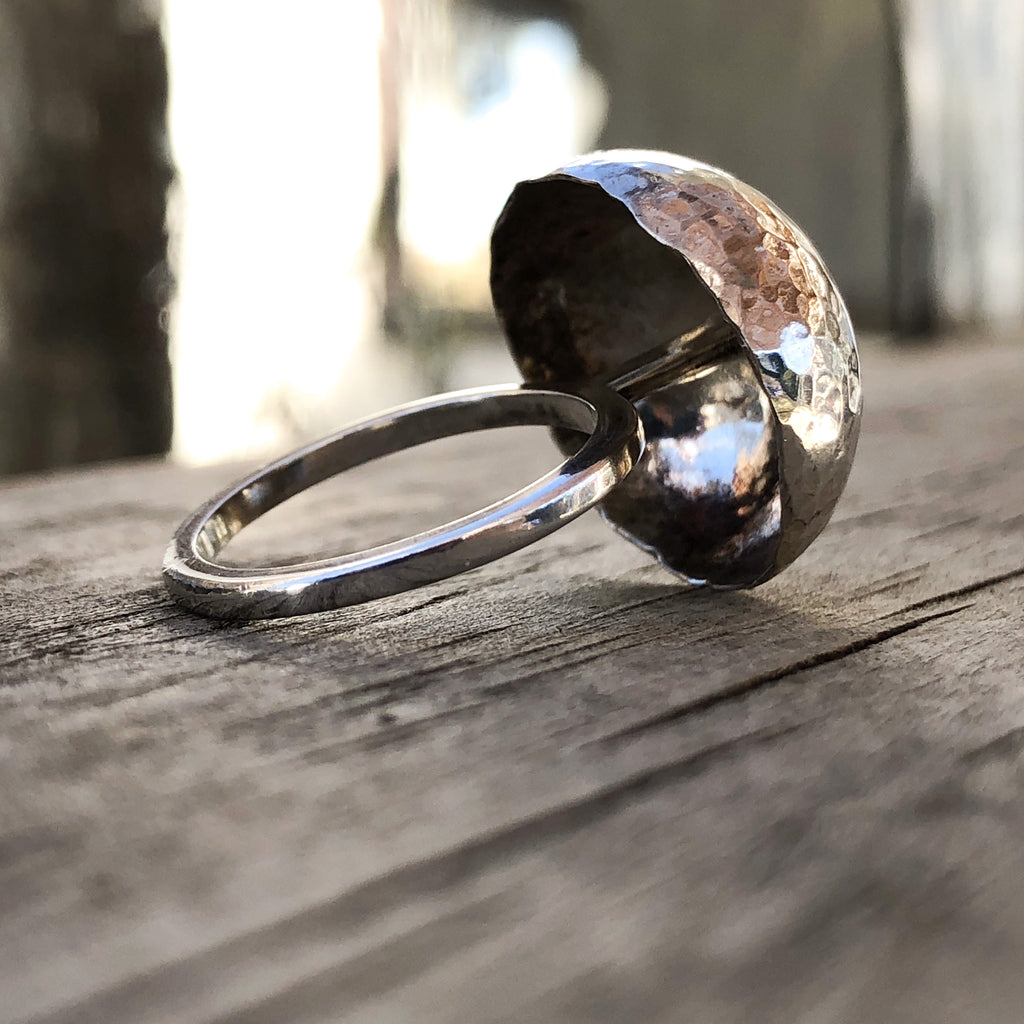 Sterling silver statement ring.  Hammered dome creating a mushroom shape on a stalk.  2mm square profiled round ring shank.  Light weight and sparkly.