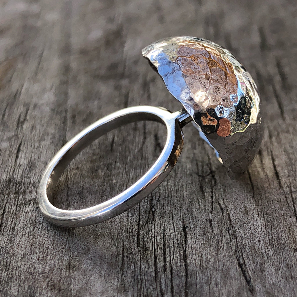 Sterling silver statement ring.  Hammered dome creating a mushroom shape on a stalk.  2mm square profiled round ring shank.  Light weight and sparkly.